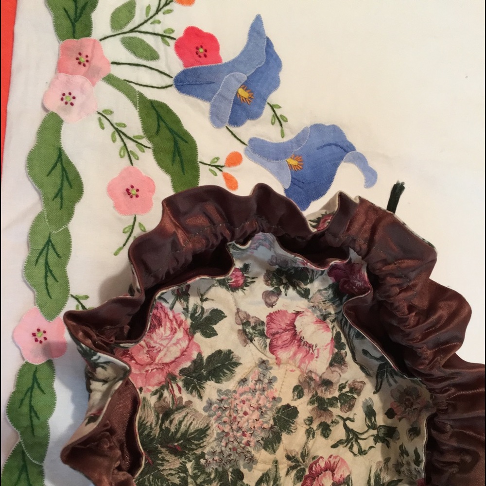New round floral pull jewelry pouches, $8.50 .